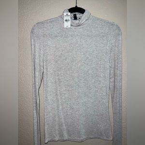 Shimmer turtleneck blouse from Express never worn.